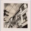 Two men standing on fire escape (ddr-densho-426-21)