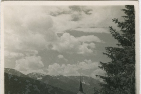Man looking out over rooftops (ddr-densho-201-434)