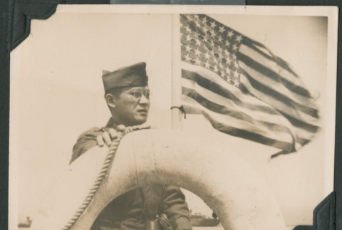 Nisei soldier with American flag (ddr-densho-397-337)