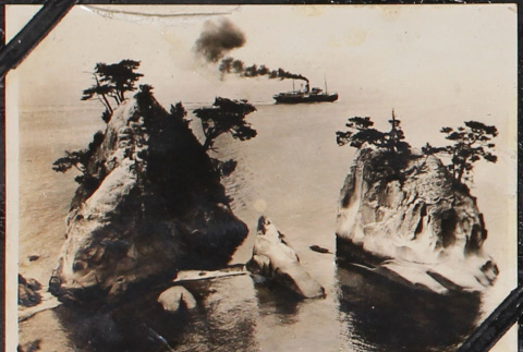 Rocks with ship in background (ddr-densho-326-258)