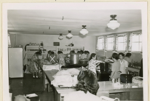 Preparing lunch at a home economics kitchen (ddr-densho-37-1121)