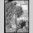 Woman in front of ivy-covered building (ddr-densho-475-145)