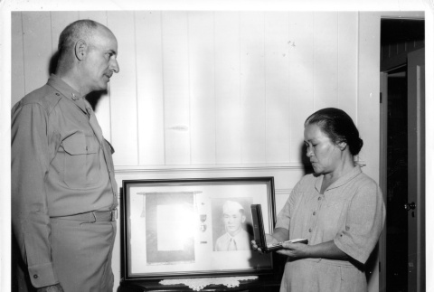A mother receiving her son's Silver Star (ddr-densho-114-33)
