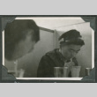 Two men drinking from straws (ddr-densho-540-34)