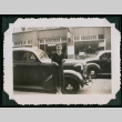 Woman poses in front of car (ddr-densho-359-1063)