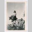 Woman on rock formation (ddr-densho-475-205)