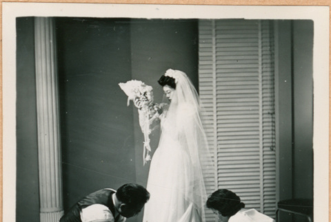 Tomoye (Nozawa) Takahashi in wedding dress with bouquet (ddr-densho-410-465)