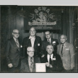 Six men in front of sign for Wisconsin Chapter of Wireless Association (ddr-densho-523-617)