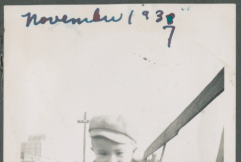 Photo of a toddler in a jacket and hat crawling (ddr-densho-483-705)