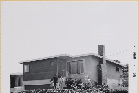 Shiomi family standing in front of house (ddr-densho-522-509)