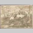 Issei men and white women in a wooded bower (ddr-densho-259-156)