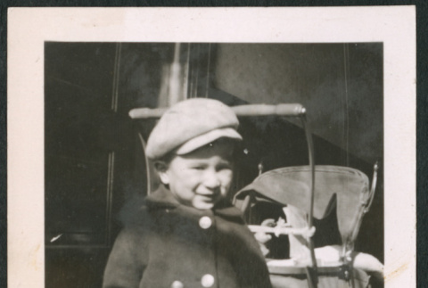 Photo of a child in a coat and hat (ddr-densho-483-760)