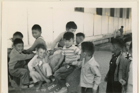 Canal boys riding a toy horse (ddr-densho-37-980)