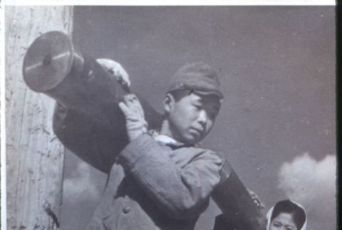 Carrying cylinders (ddr-densho-1007-689)