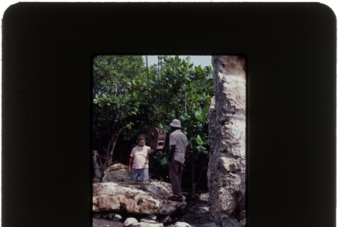 Two men moving a boulder (ddr-densho-377-577)