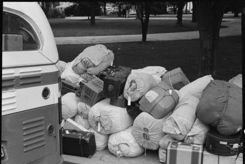 Baggage of Japanese Americans next to bus (ddr-densho-151-165)