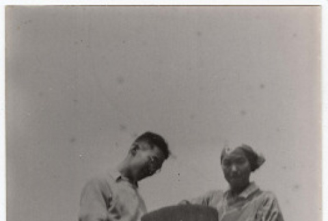 Richard Tsukada and local at Oshima Island (ddr-densho-356-25)