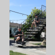 Two people sitting on steps eating (ddr-densho-512-95)