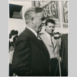 Man speaking at microphone (ddr-densho-426-985)