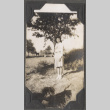 Woman standing by tree (ddr-densho-466-217)