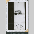 View of small huts and gate (ddr-densho-434-313)