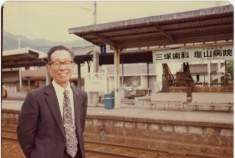 Man standing in train station (ddr-densho-426-173)