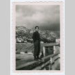 Soldier standing on ledge in front of mountains (ddr-densho-368-241)