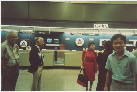 Group at SeaTac Airport on the way to the ceremony for the signing of the Civil Liberties Act of 1988 (ddr-densho-10-198)