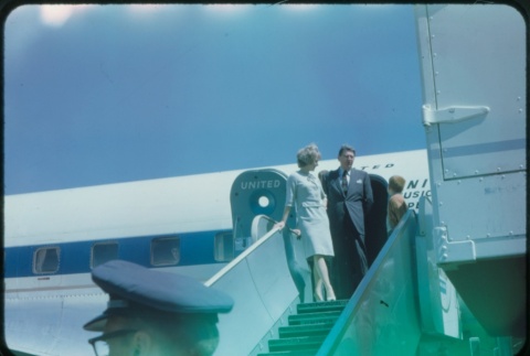 A man, woman, and child deboarding a plane (ddr-densho-338-514)