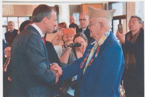 Saburo Arthur Kitagawa being presented with the Legion of Honor Chevalier award from Consul General of France (ddr-densho-539-30)