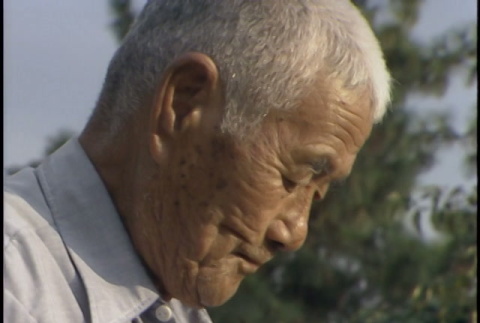 John Kaneko and father digging; interview with father (ddr-densho-1007-1650)