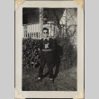 Man in sunglasses and letterman sweater (ddr-densho-466-911)