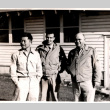 Three men outside building (ddr-densho-563-19)