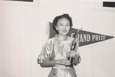 Woman holding a trophy (ddr-njpa-2-173)