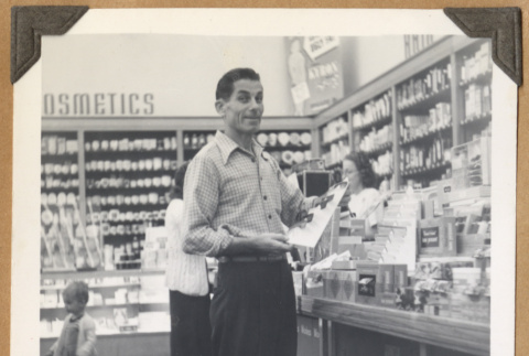Man shopping at The Owl Drug Co. (ddr-densho-542-114)