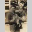 Sojin Kamiyama posing with a dog (ddr-njpa-4-604)