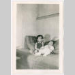 Miki and Anyo Domoto sitting on sofa (ddr-densho-329-1352)