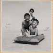 Woman and two boys playing on beach (ddr-densho-522-287)