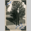 Bob Higashida in suit standing on lawn (ddr-densho-383-121)