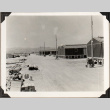 Row of barracks and lumber piles (ddr-densho-587-83)