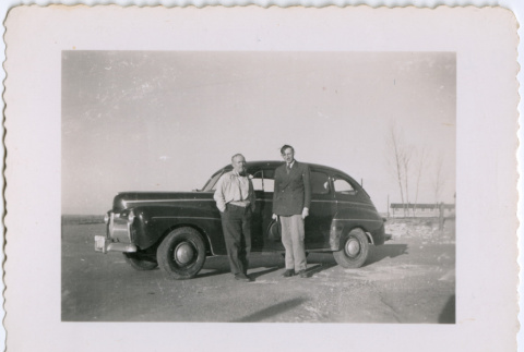 Two men in front of car (ddr-densho-377-1652)