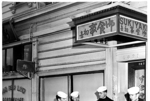 Four servicepeople and one civilian in white overalls outside sukiyaki restaurant (ddr-densho-1007-45)
