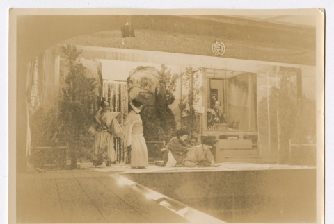 Men and women in traditional Japanese clothing performing in a play (ddr-densho-223-45)