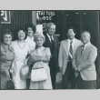 Seven people outside Tai Tungs (ddr-densho-523-657)