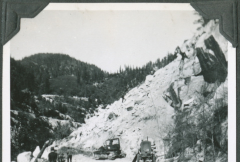 Men and equipment by large landslide (ddr-ajah-2-368)