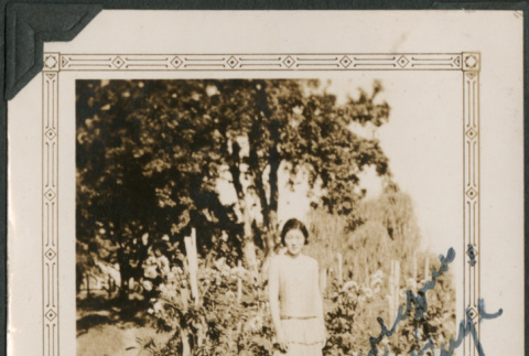 Woman standing in field (ddr-densho-316-222)