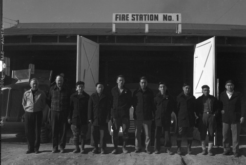 Firemen standing in front of Fire Station No. 1 (ddr-fom-1-756)