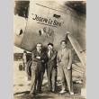 Three men standing in front of the 