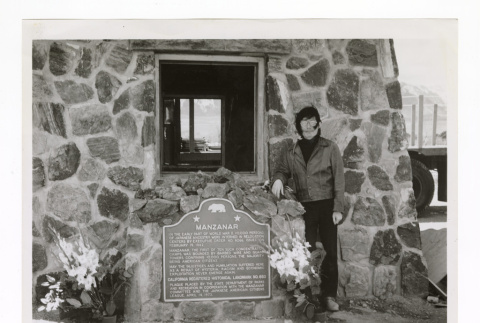 George Takei stands with commemorative plaque designating Manzanar a State Monument (ddr-csujad-52-37)