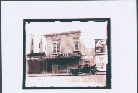 Photo of Starlight Laundry with car in front (ddr-densho-423-452)